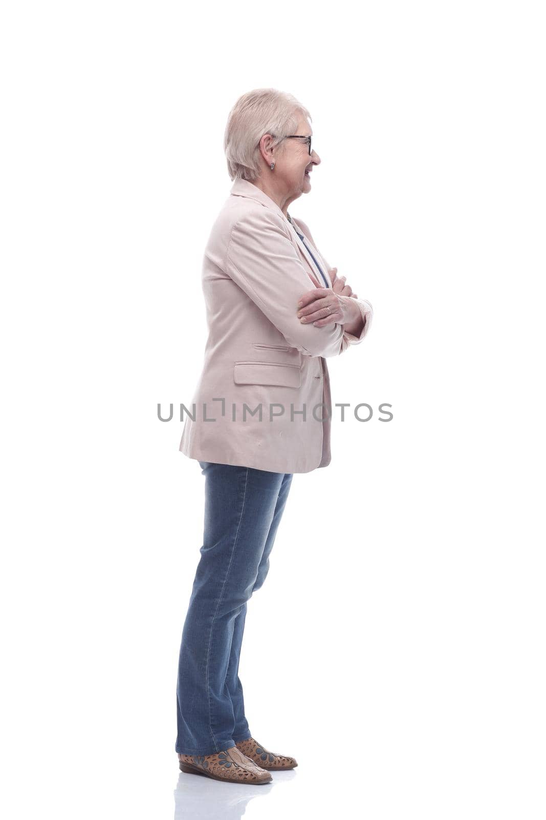 side view. modern elderly woman looking forward . isolated on a white background