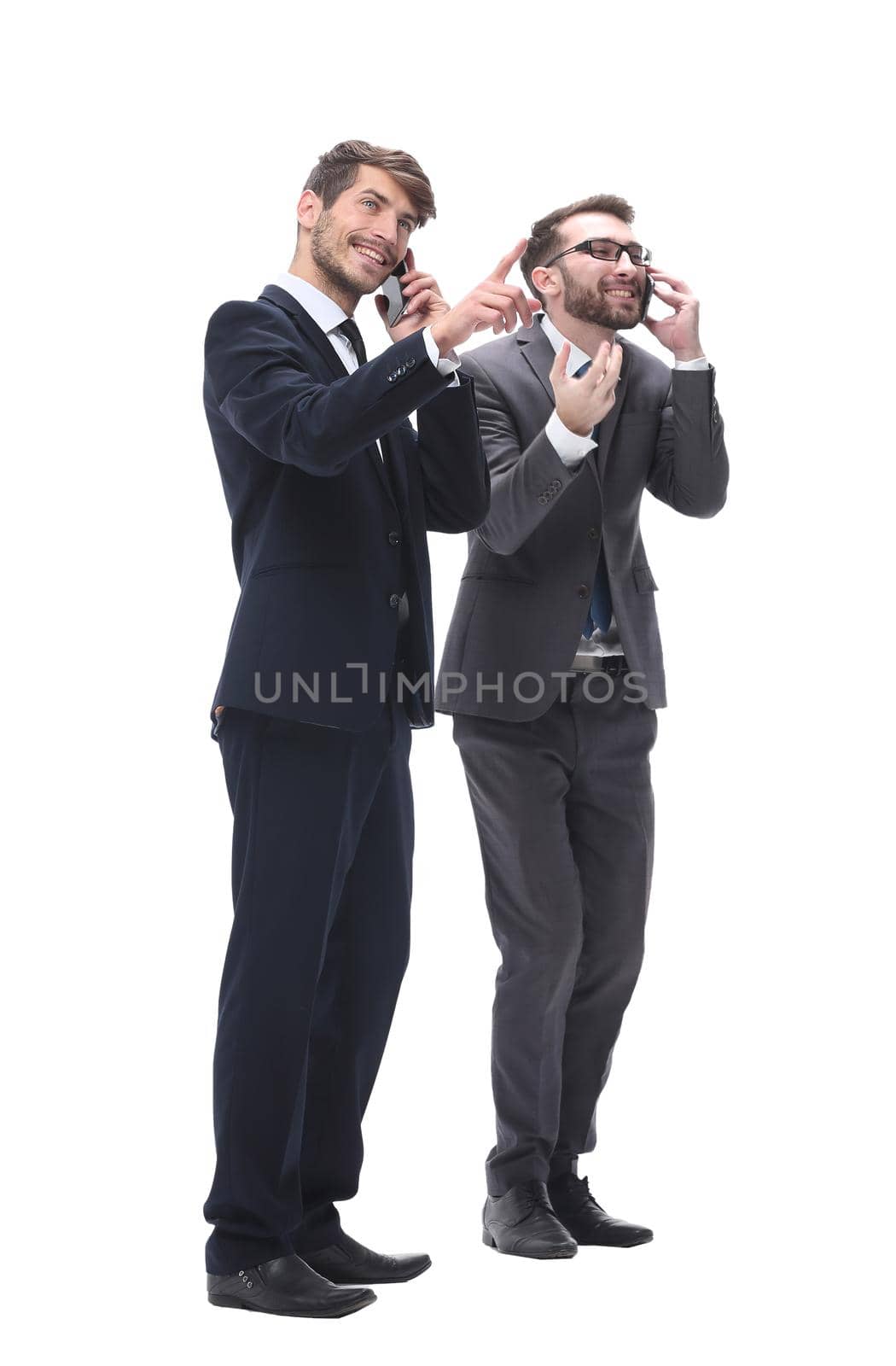 full length . two businessmen using their smartphones by asdf