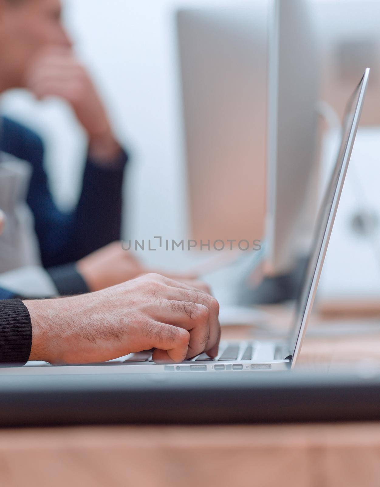 close up. image of a laptop on an office Desk . people and technology