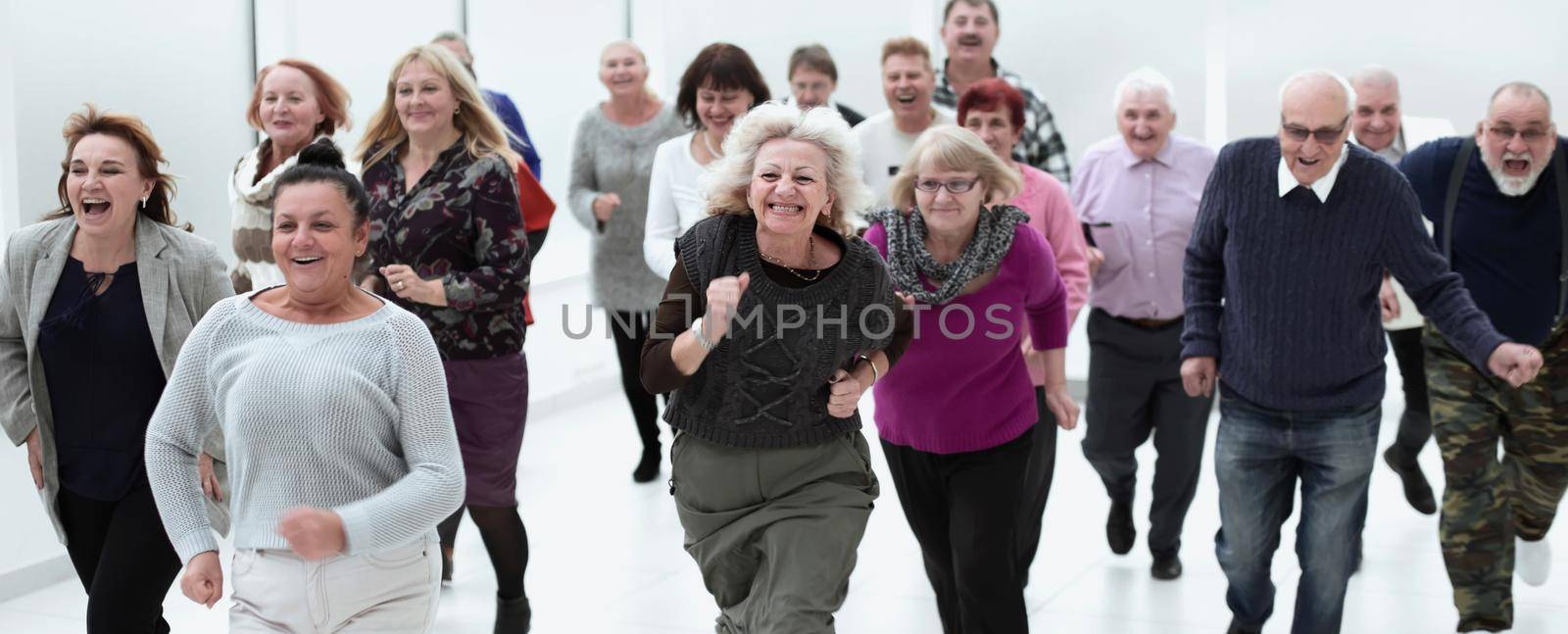 a group of retirees are running for retirement. group of older p by asdf