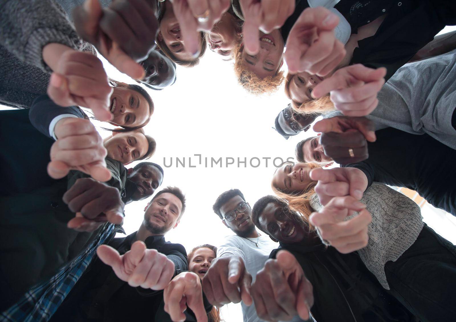 group of smiling young people pointing at you by asdf