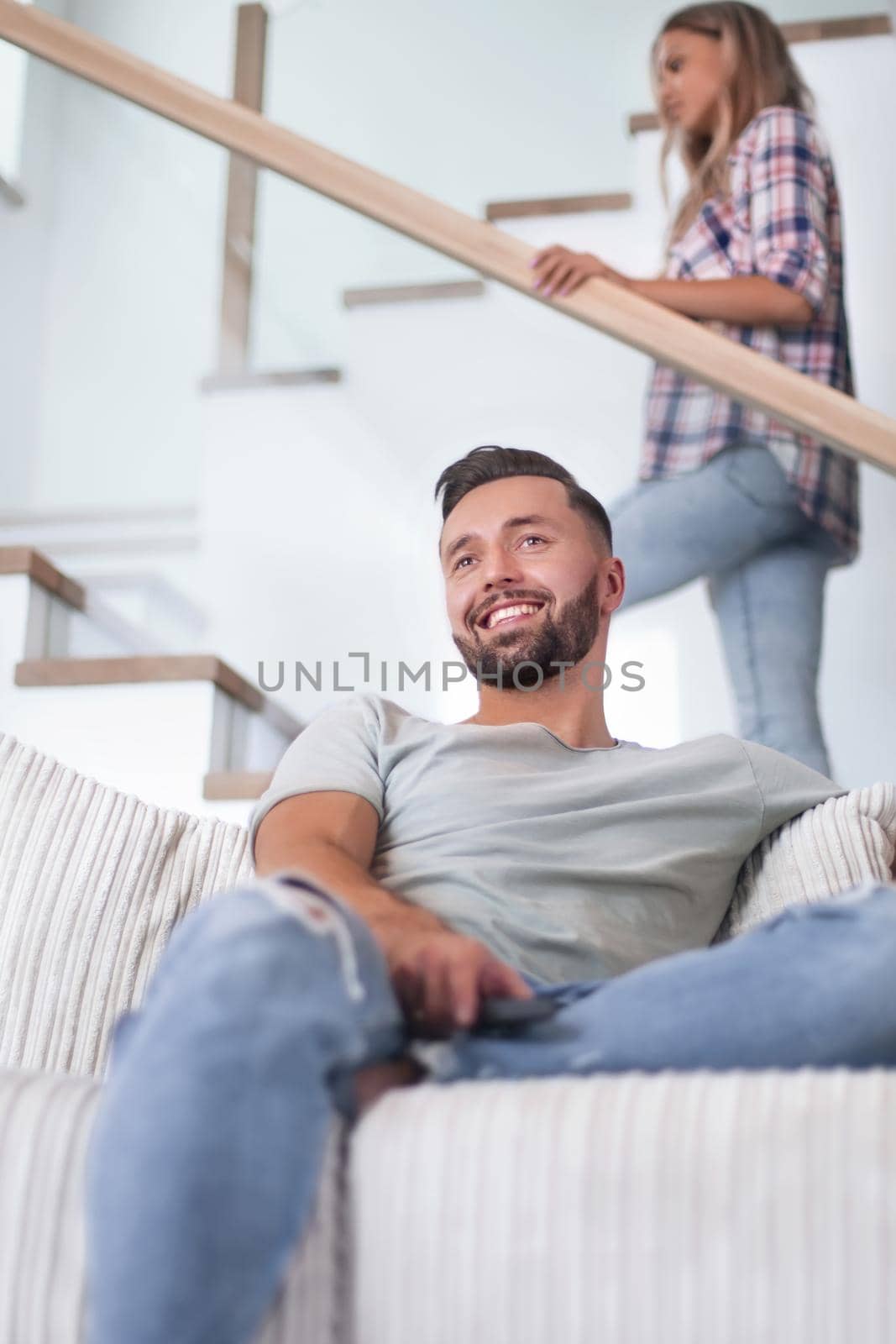 close up. young man sitting on sofa. photo with copy space