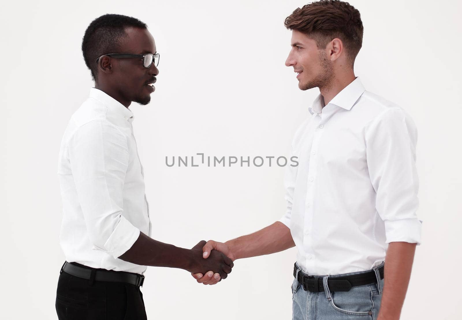 young business partners shaking hands.the concept of cooperation