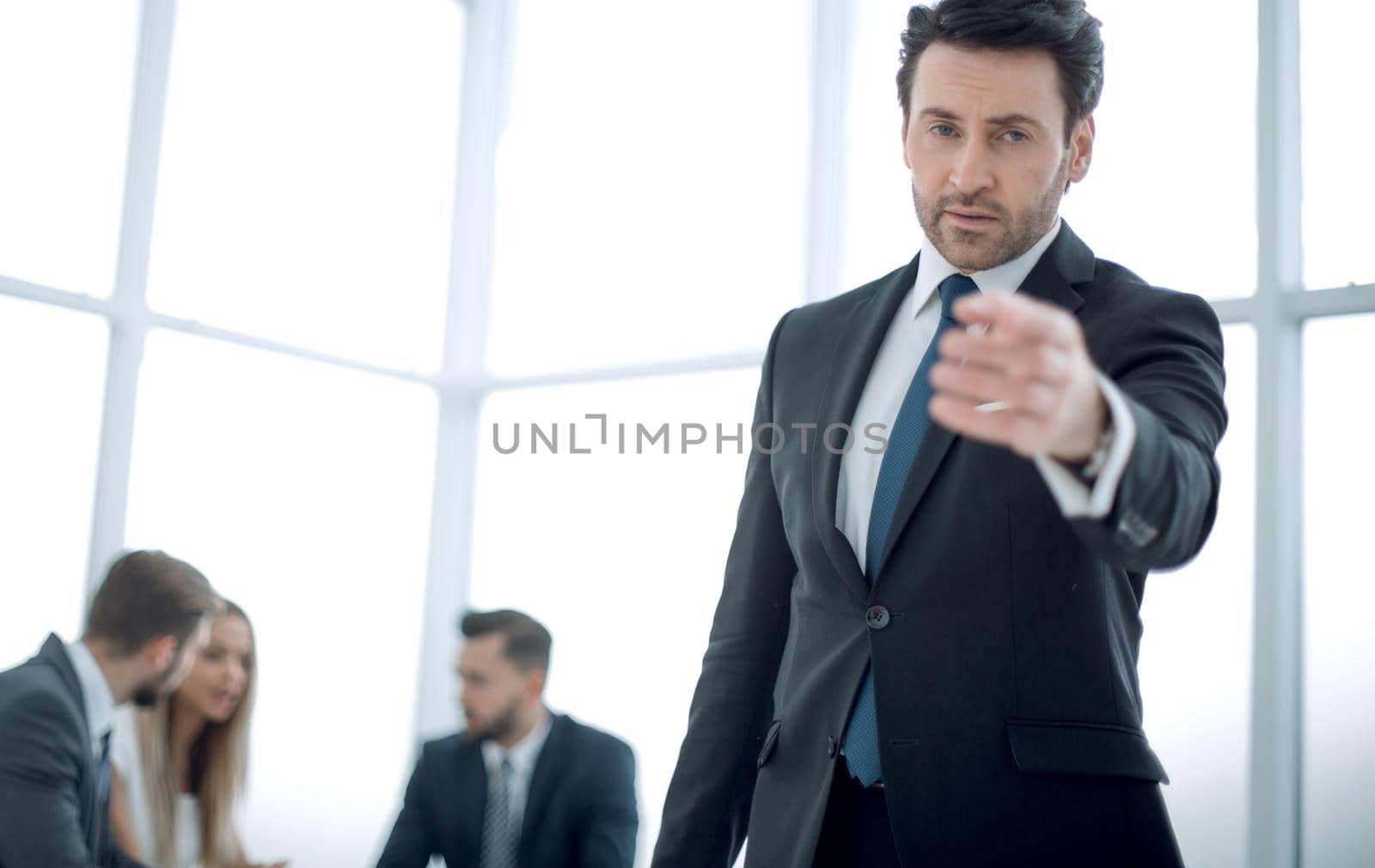 serious businessman pointing at you.business concept