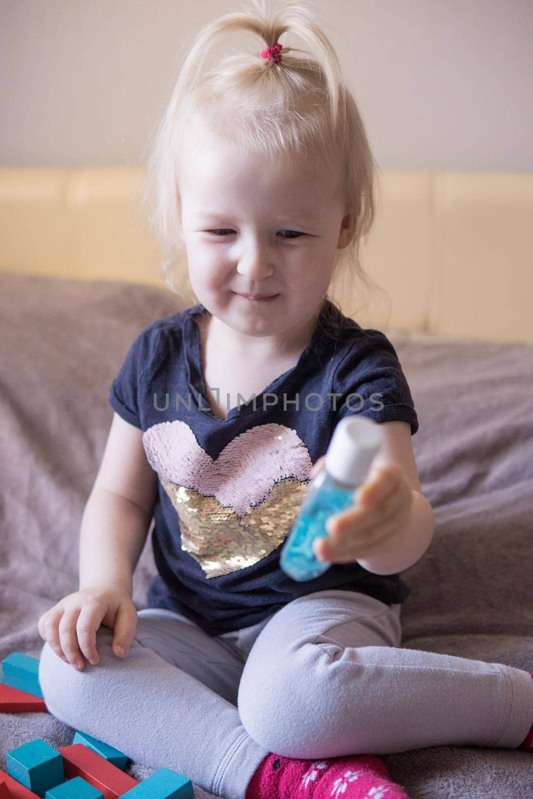 Children's hands with antiseptic gel. A child in quarantine, a child at home. Close-up, selective focus. by Annu1tochka