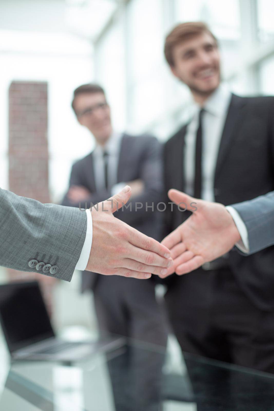 close up. handshake of reliable business partners . by asdf