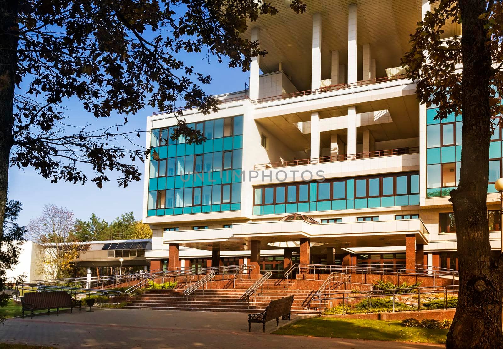 The modern building and landscaped grounds around.