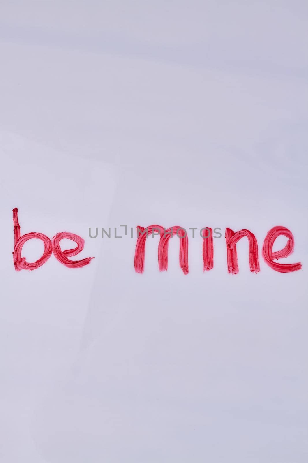 Top view of be mine hand-written love text. Copy space for text.