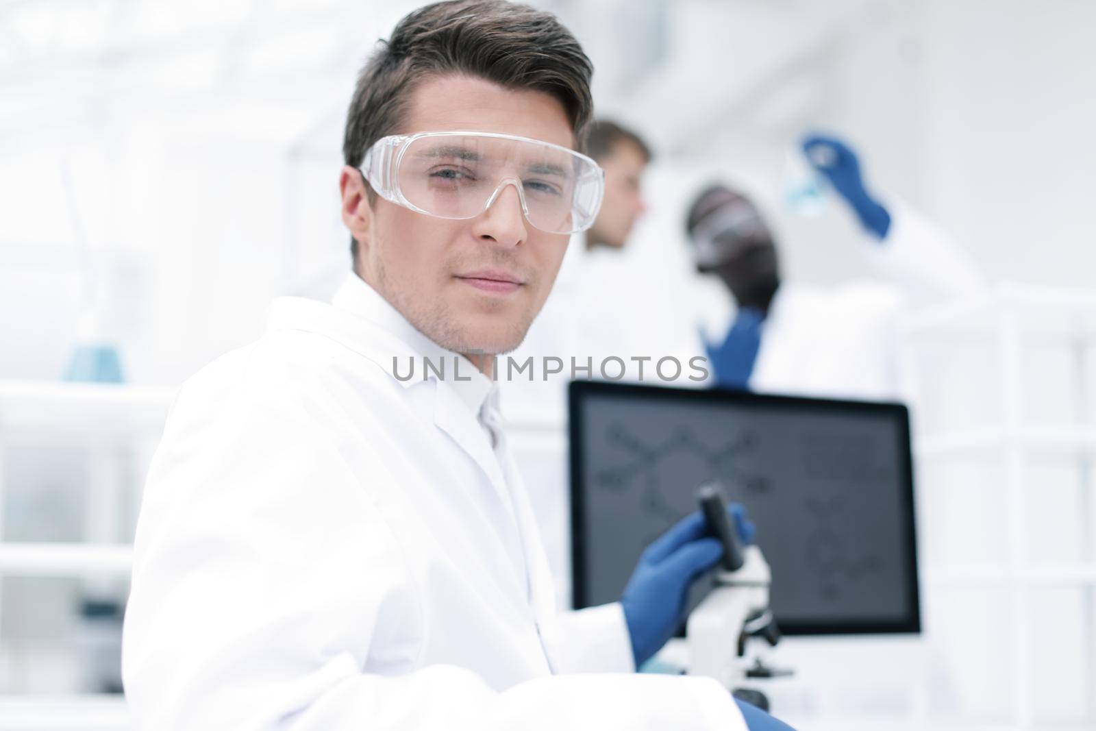 close up. scientist microbiologist at the laboratory table by asdf