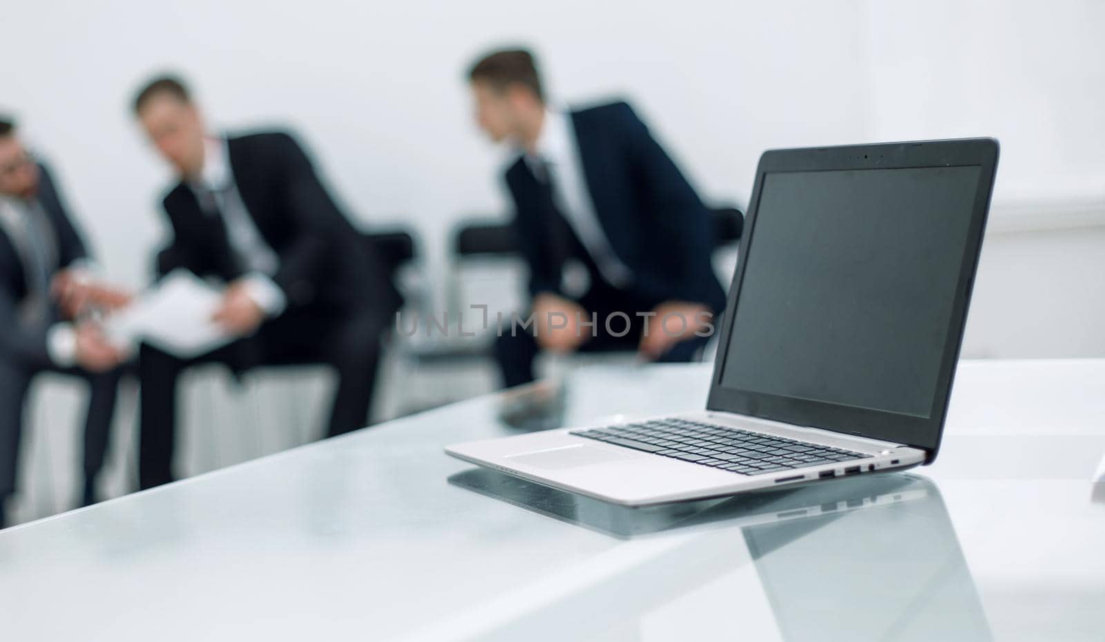 background image office reception. laptop on table by asdf