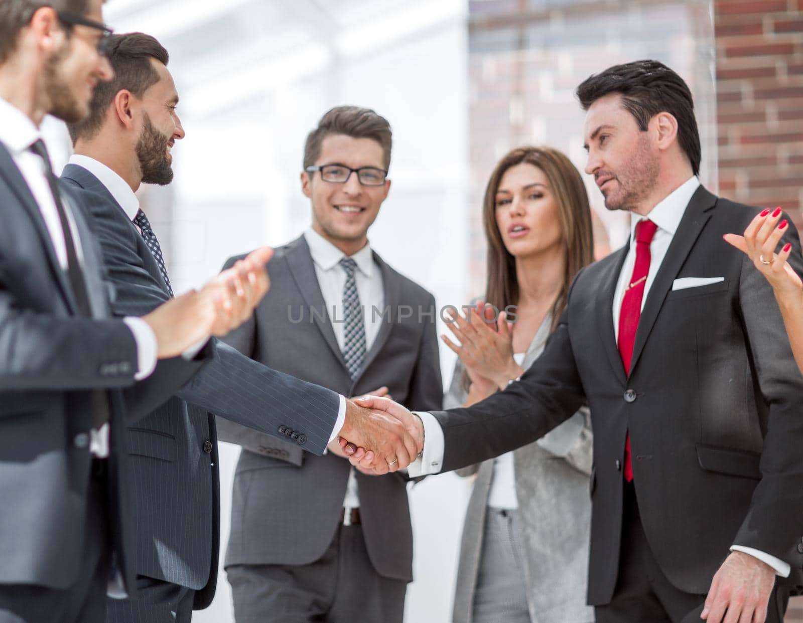 business partners shaking hands. handshake by asdf
