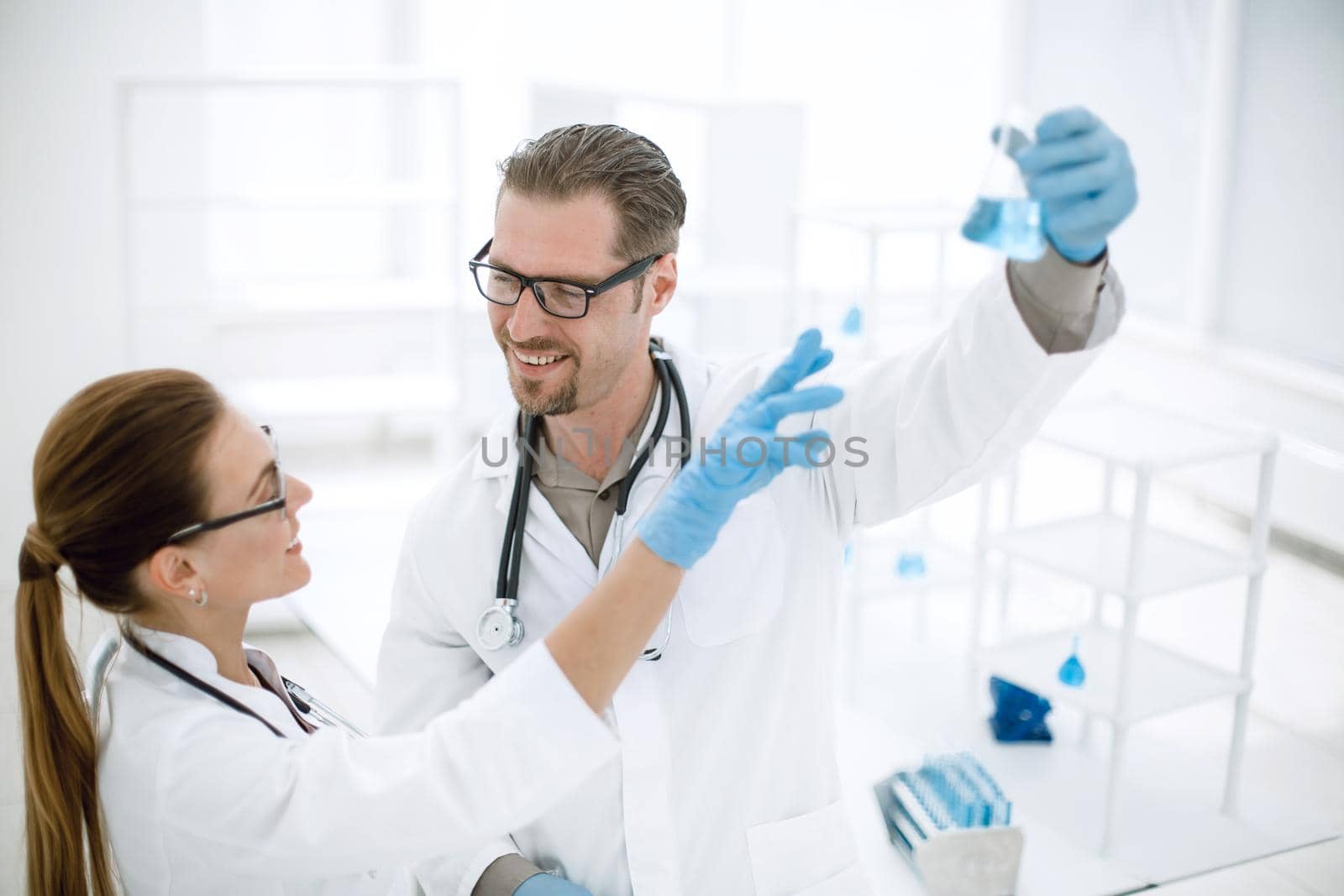 close up.researchers discuss the results, standing in the laboratory