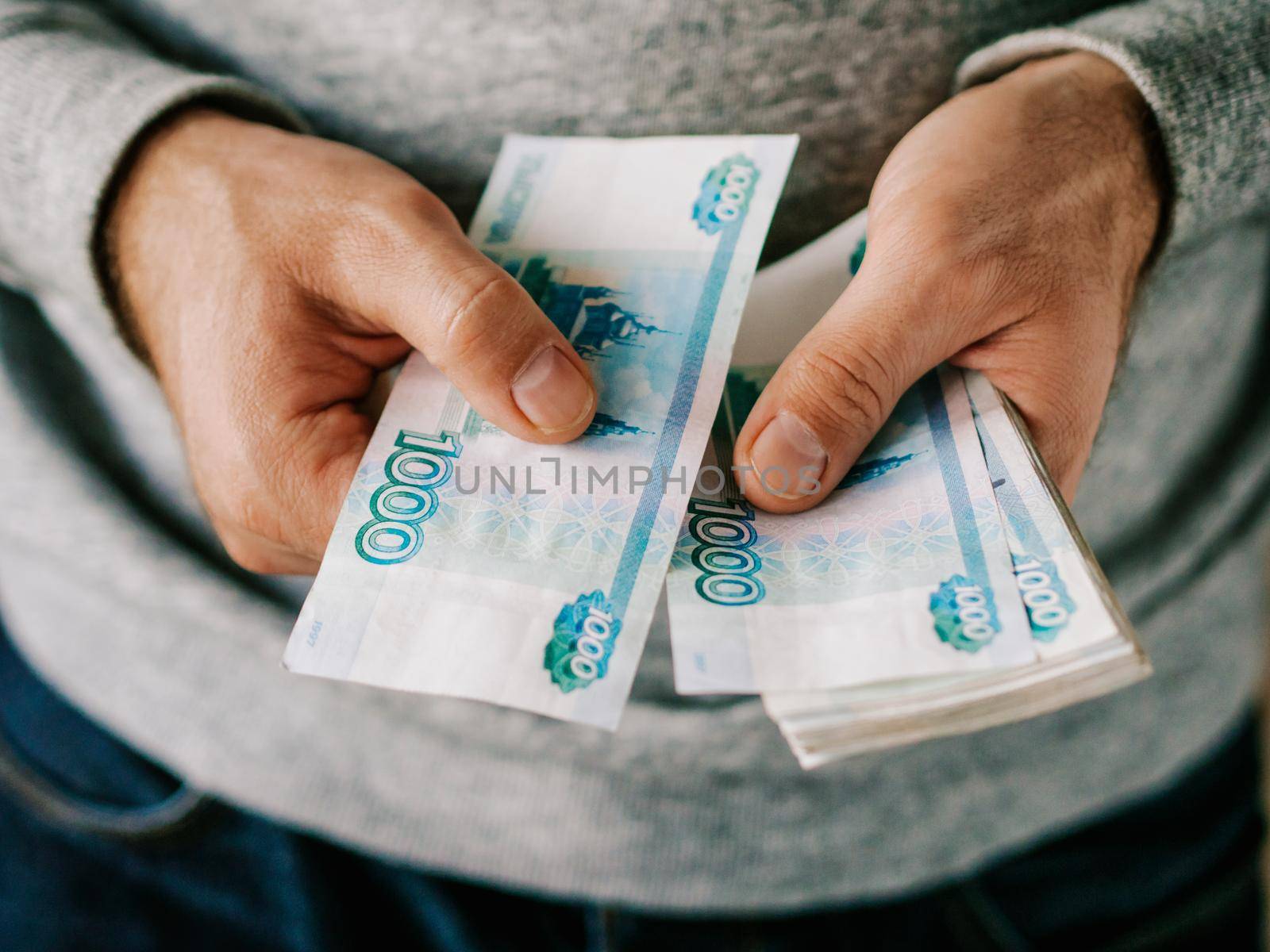 Hands counting russian rubles. Selective focus. Shallow DOF