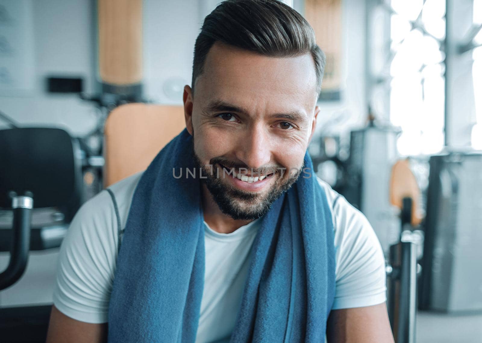 close up.portrait of a sporty young man in the gym .healthy lifestyle