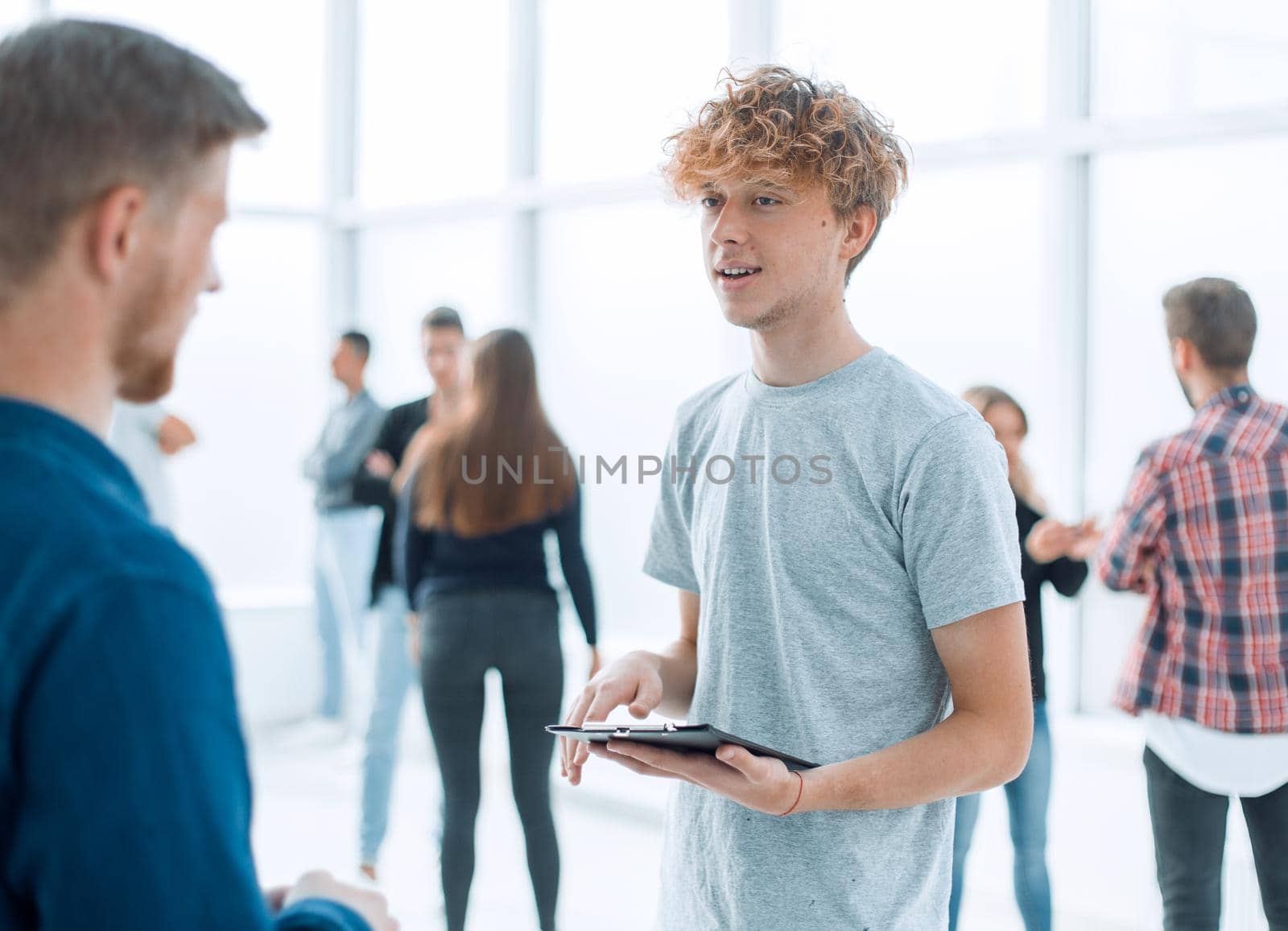 close up. young colleagues discussing business documents. business concept