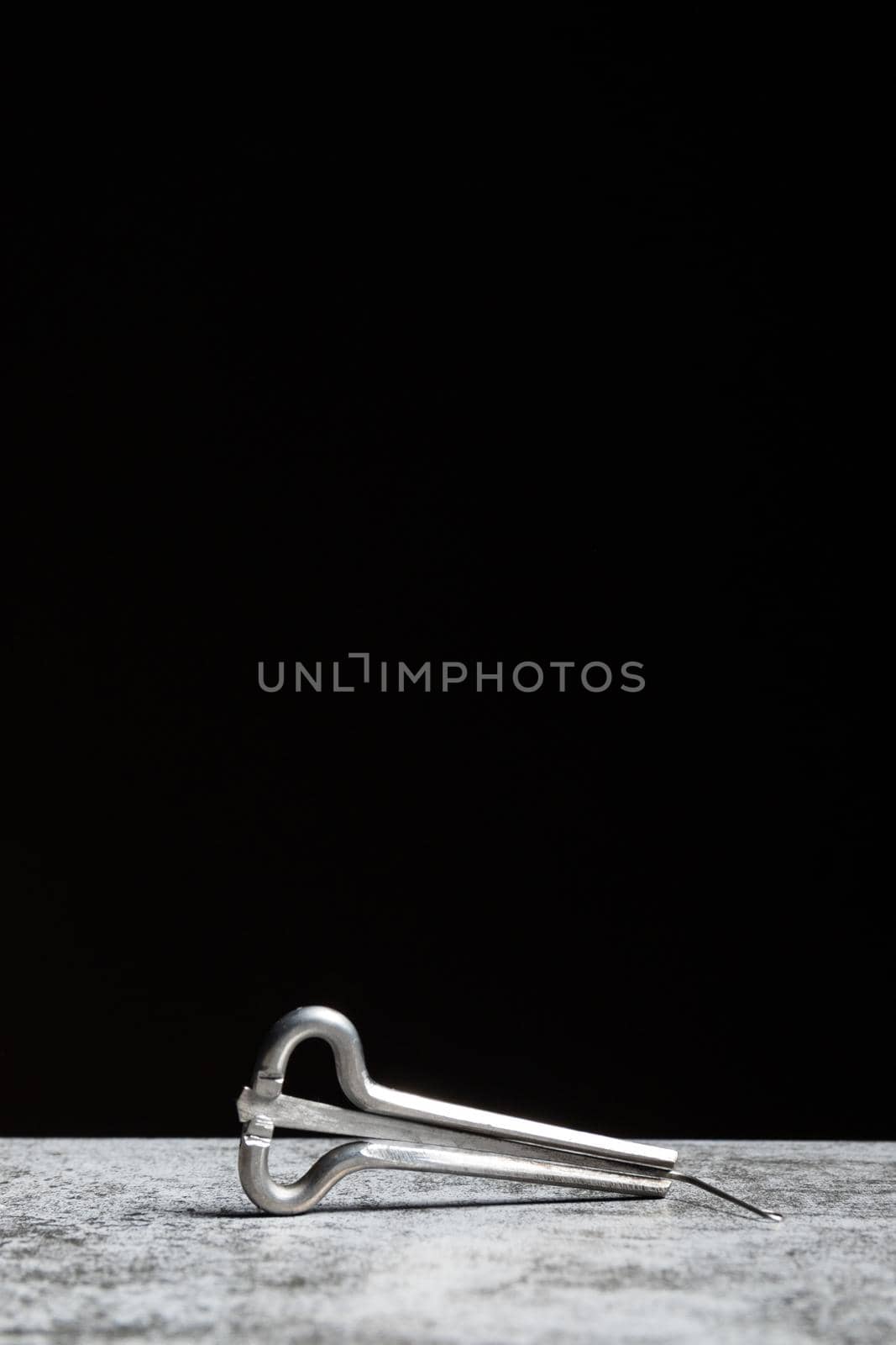 Shankobyz - Kazakh musical instrument on a black background with vertical copy space.