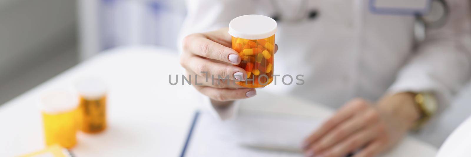 Therapist holding medicines in hand by kuprevich