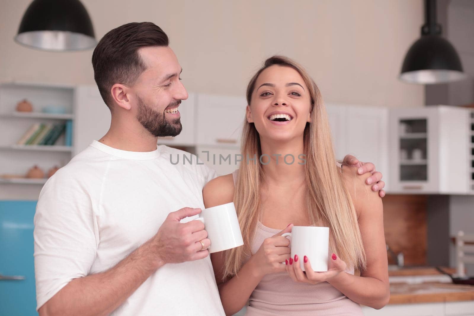 close up.dreams of a young couple standing in their kitchen