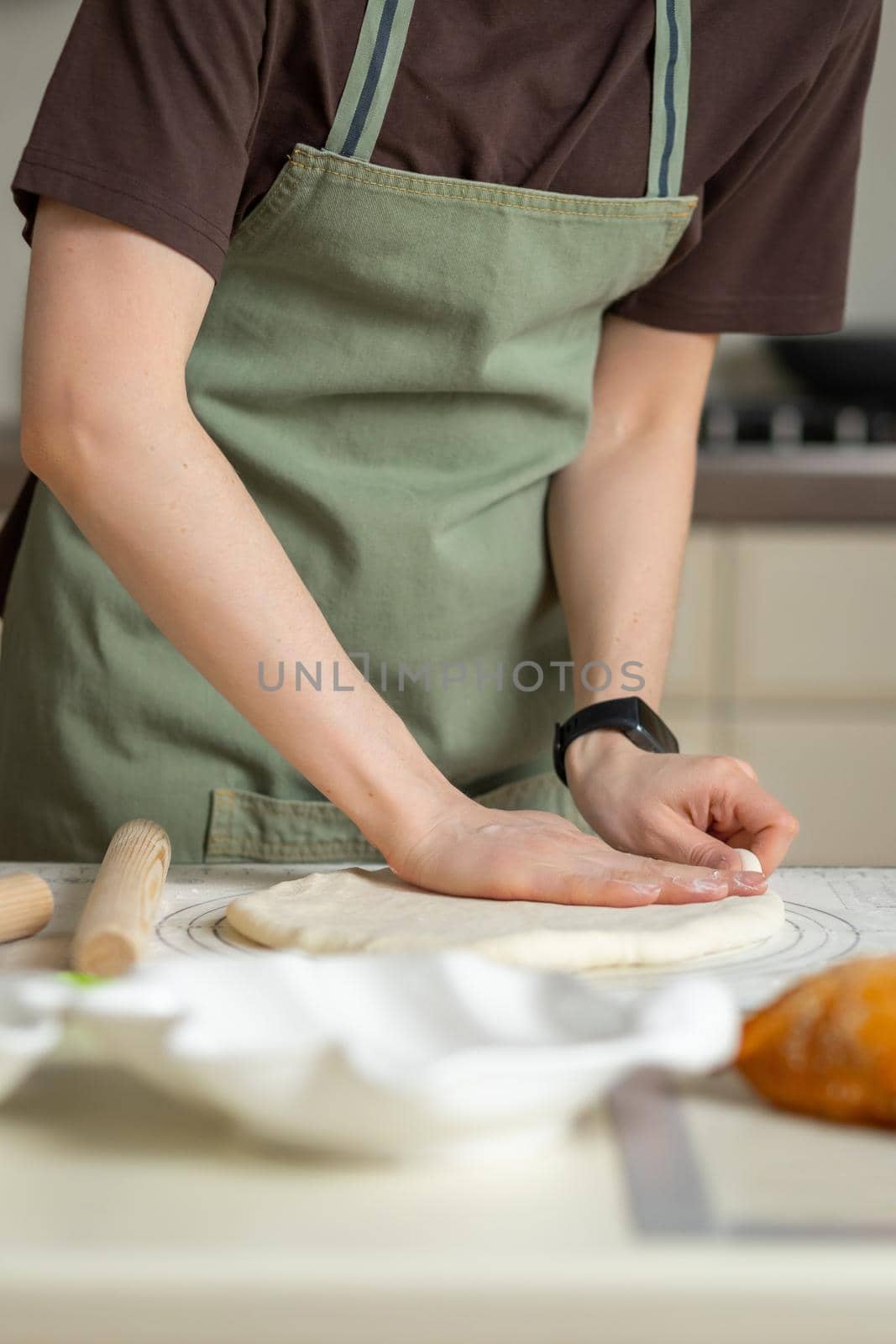 View of the chef's hands in the process of cooking. Copy space, vertical.