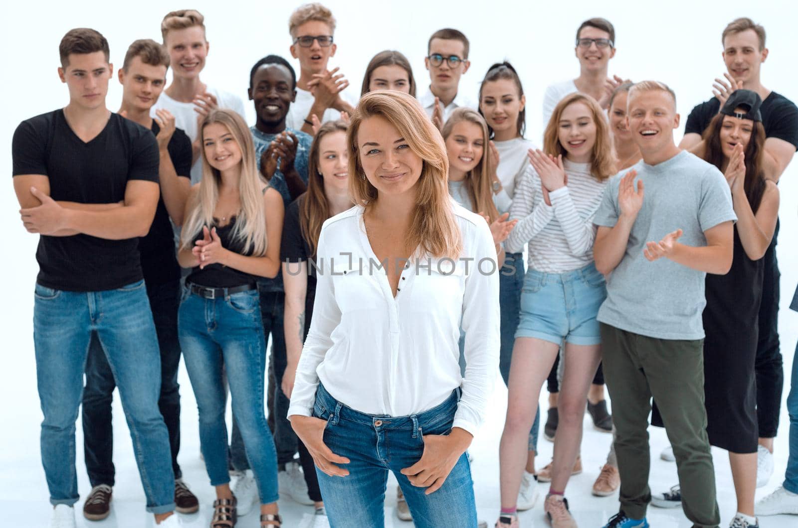 confident business woman standing in front of a young business team by asdf