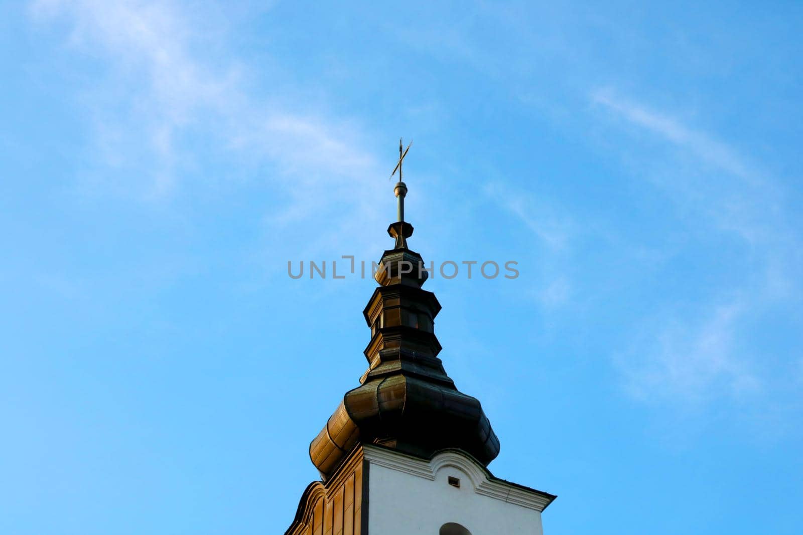 The old dome of the church against the blue sky