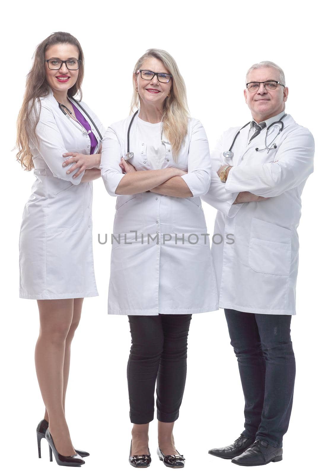 in full growth. a friendly female doctor standing in front of her colleagues. by asdf