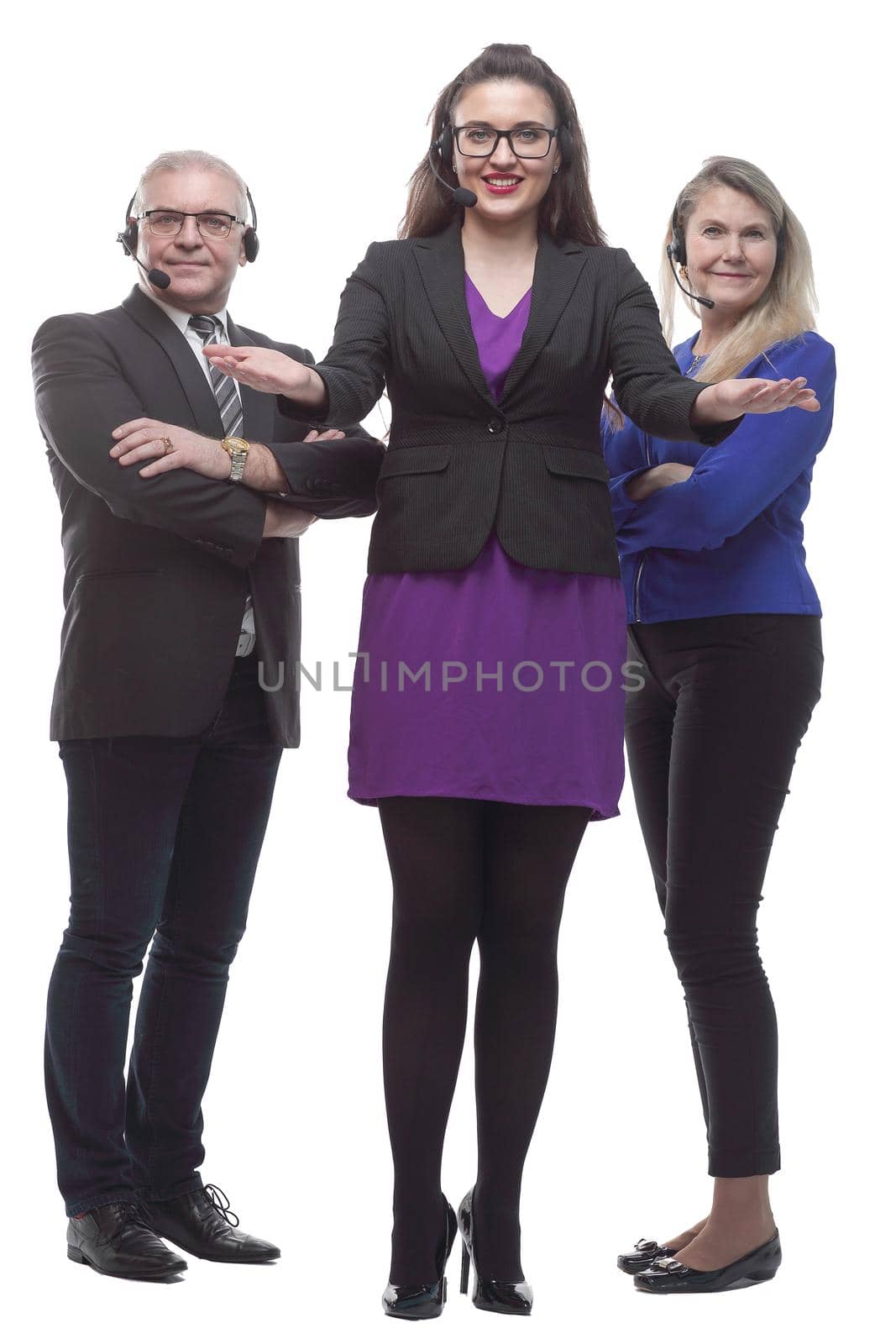 in full growth. a friendly business lady in a headset inviting you . isolated on a white background