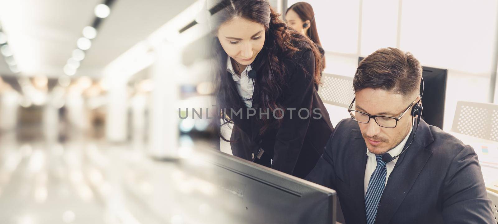 Business people wearing headset working in office broaden view by biancoblue