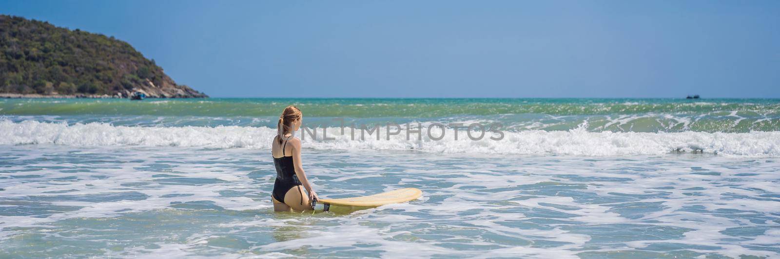 BANNER, LONG FORMAT Beautiful young woman ride wave. Sporty surfer woman surfing on the background of blue sky, clouds and transparent waves. Outdoor Active by galitskaya