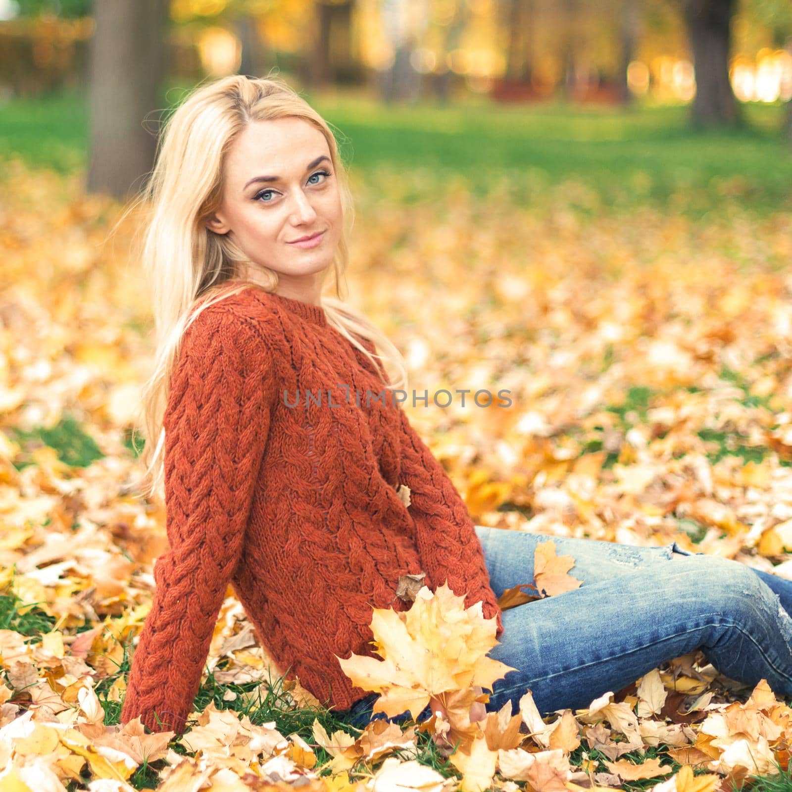 Young woman in park on autumn day by okskukuruza