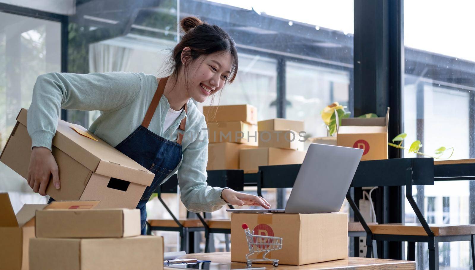 Starting small businesses SME owners female entrepreneurs check online orders to prepare to pack the boxes, sell to customers, sme business ideas online..