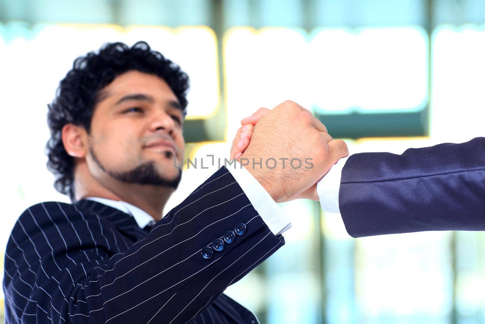 The conclusion of the transaction. Handshake.