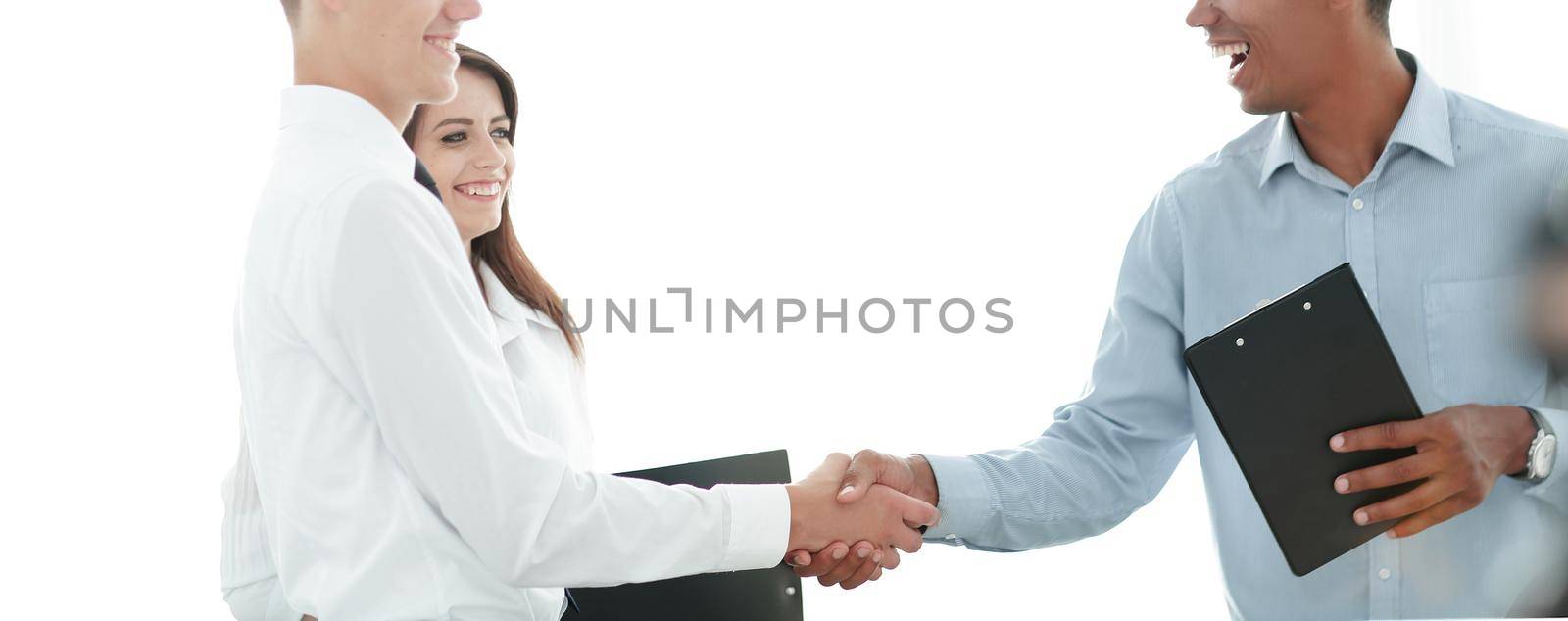handshake of business people standing in office by SmartPhotoLab
