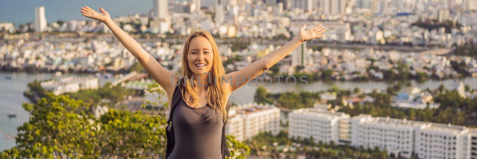 Woman tourist on the background of Nha Trang city. Travel to Vietnam Concept. BANNER, LONG FORMAT