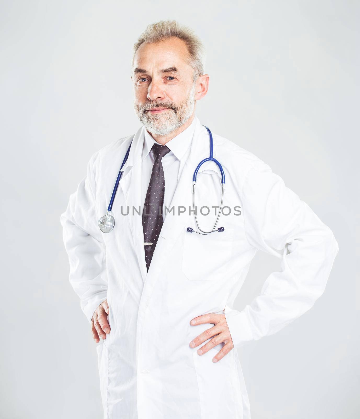 therapist with a stethoscope on light background. the photo has a empty space for your text