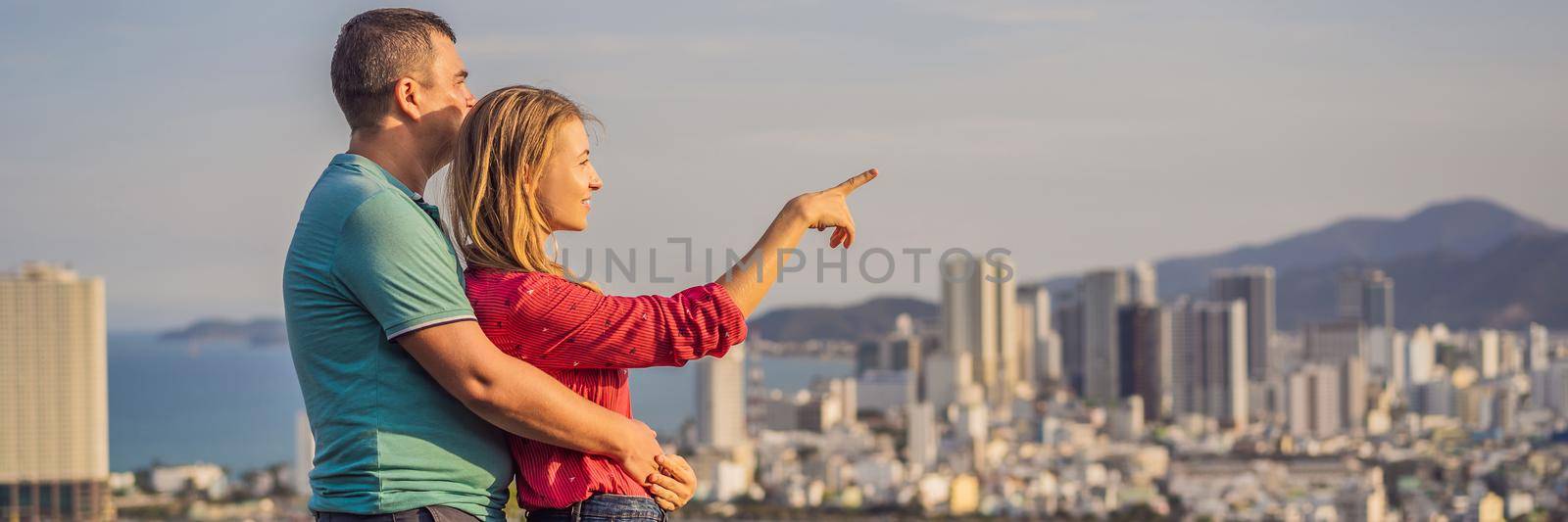 Happy couple tourists on the background of Nha Trang city. Travel to Vietnam Concept BANNER, LONG FORMAT by galitskaya