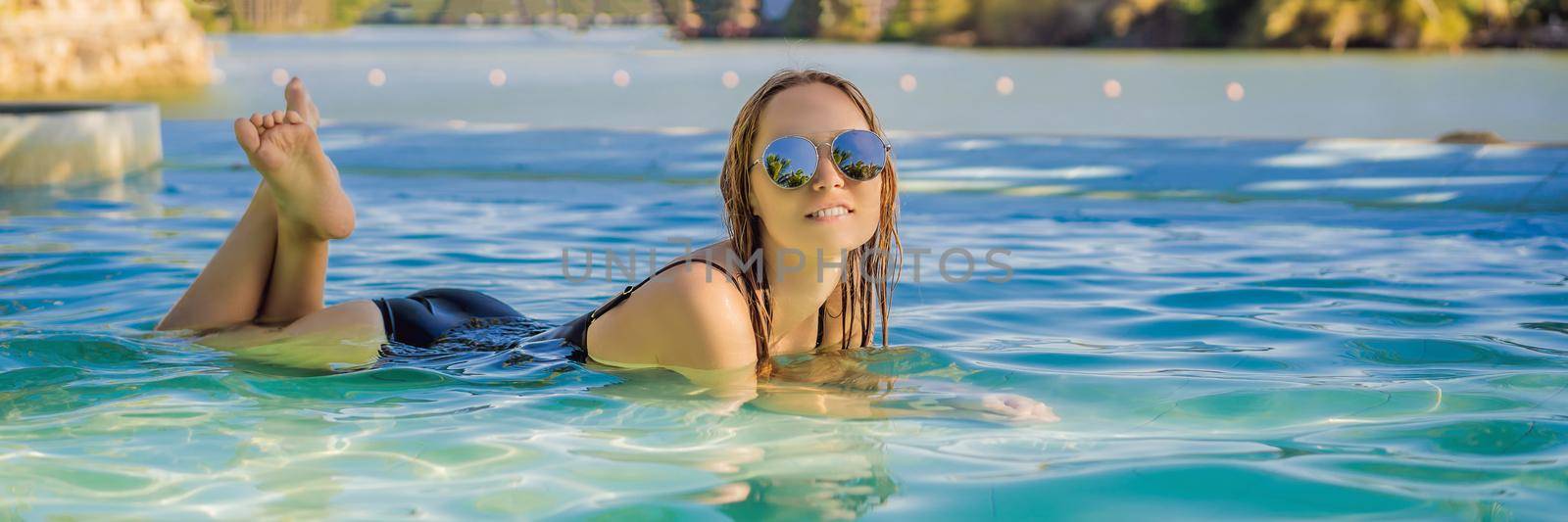 Luxury resort swimming pool. Beautiful woman tourist relaxing in holiday retreat on summer travel vacation. Bikini girl in sunbathing swimsuit enjoying ocean background. BANNER, LONG FORMAT