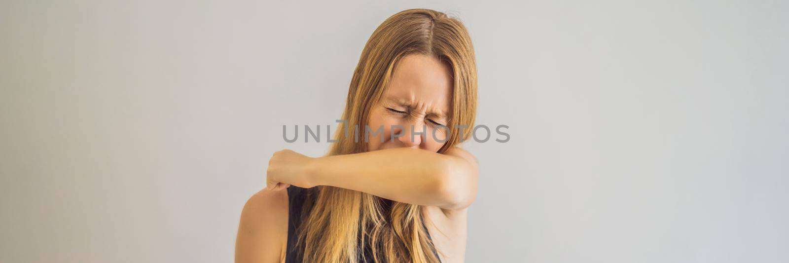 Comparison between wrong and right way to sneeze to prevent virus infection. Caucasian woman sneezing, coughing into her arm or elbow to prevent spread Covid-19,Coronavirus. BANNER, LONG FORMAT
