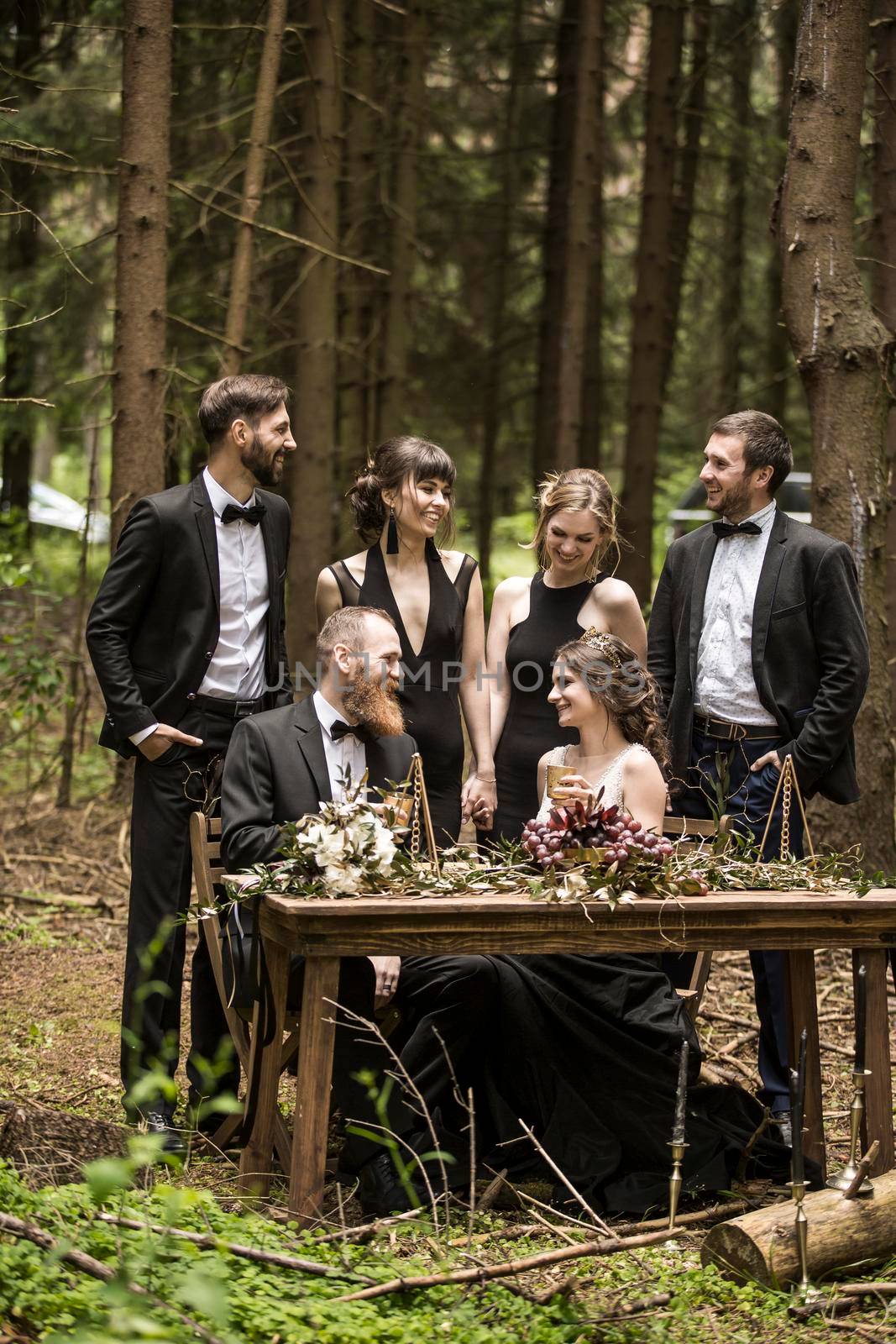 married and the witnesses at the marriage ceremony in the woods