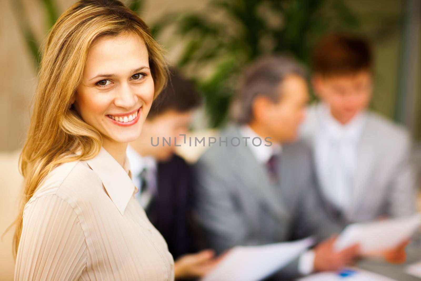 Portrait of a young confident business woman smiling