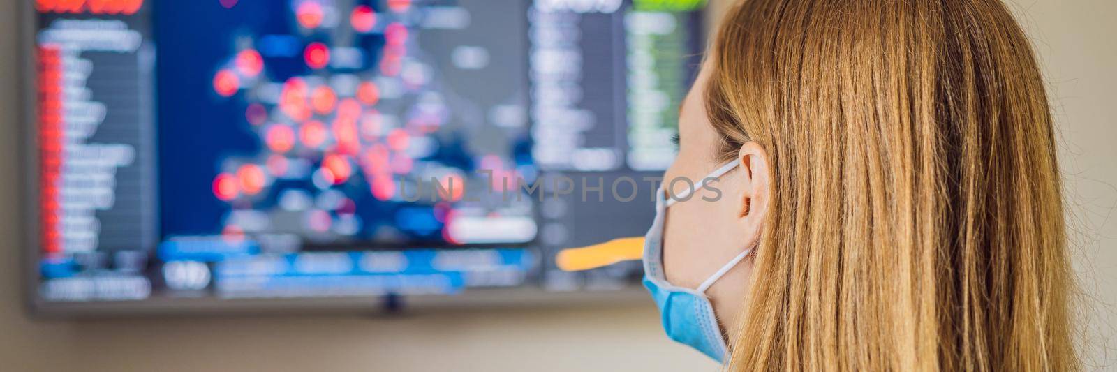Young woman checks coronavirus sars-cov-2 covid-19 global cases situation online. Coronavirus outbreak in United States of America and World. BANNER, LONG FORMAT
