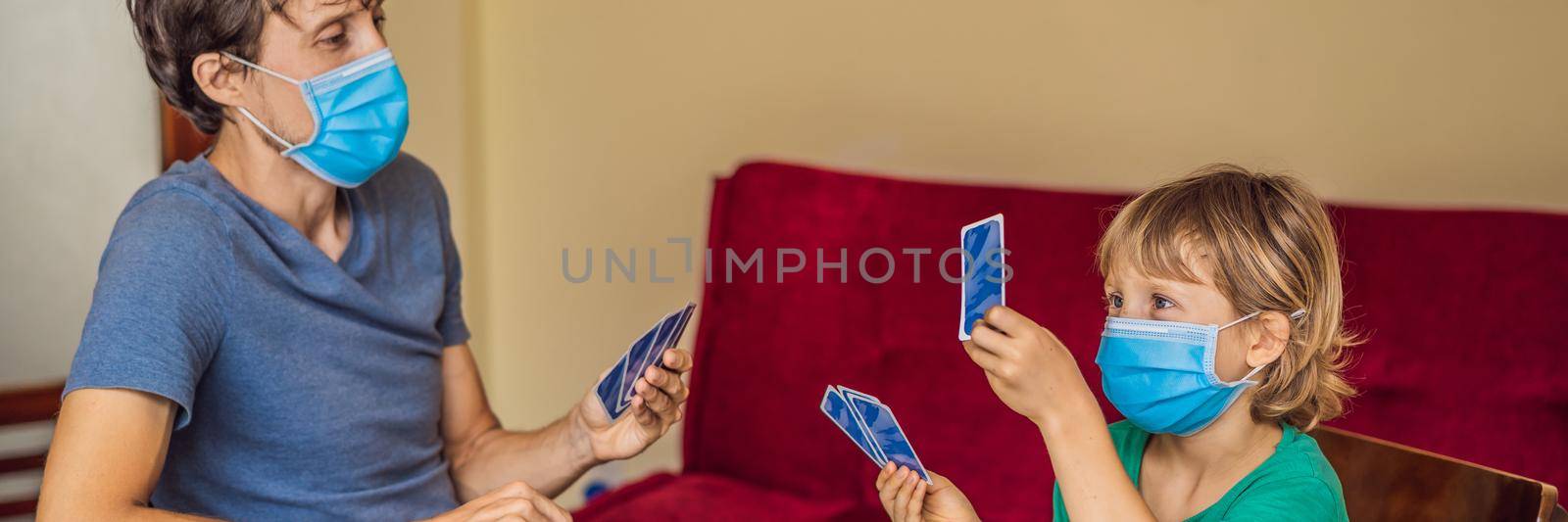 Happy Family Playing Board Game At Home. Stay at home due to quarantine. Coronovirus infection BANNER, LONG FORMAT by galitskaya