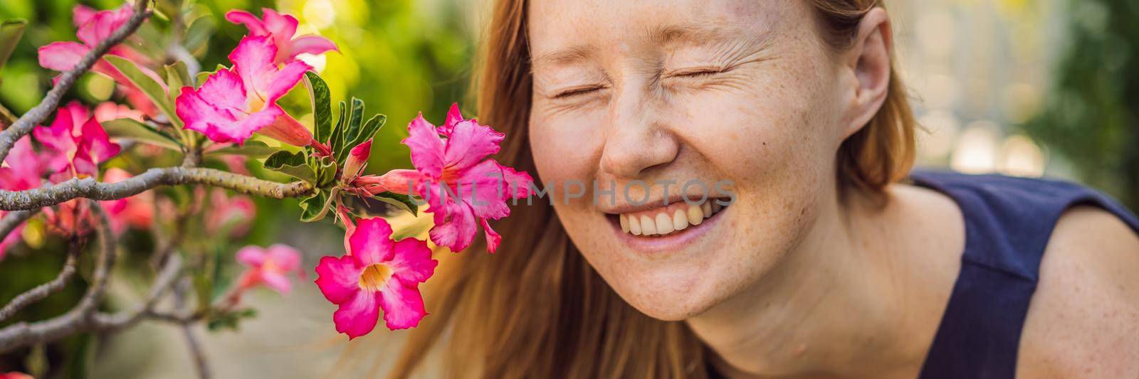 I love my skin. A young woman with freckles, moles, scars and facial wrinkles loves her skin, enjoys life and walks in a beautiful park BANNER, LONG FORMAT by galitskaya