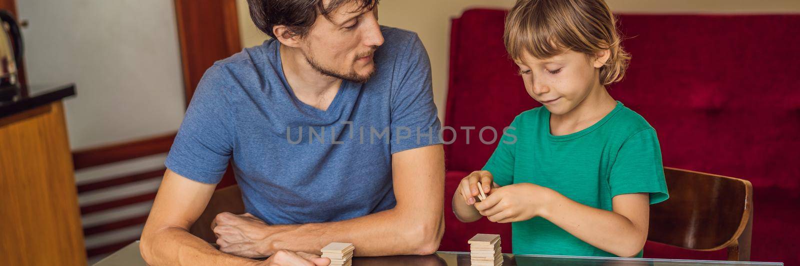 Happy Family Playing Board Game At Home BANNER, LONG FORMAT by galitskaya