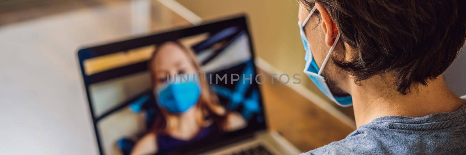 Coronavirus. Woman and man in quarantine for coronavirus wearing protective mask. Working from home and using video call. Video conference. BANNER, LONG FORMAT