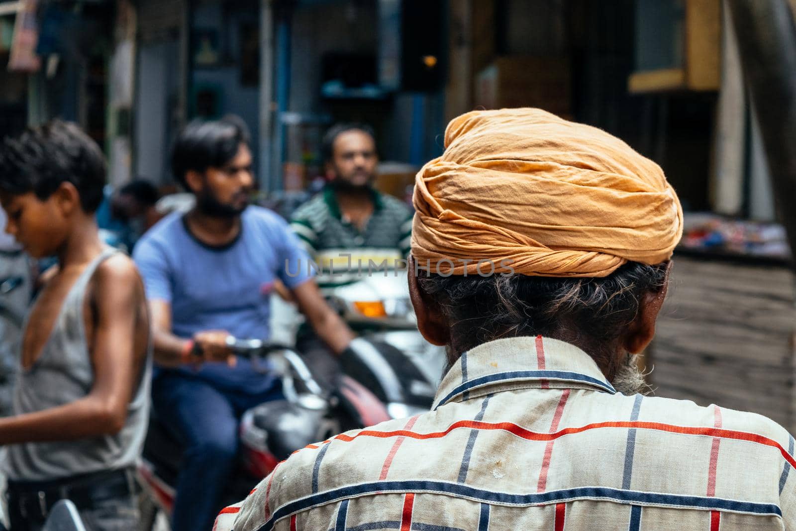 Indian unrecognizable back man with turban on his head. by Peruphotoart