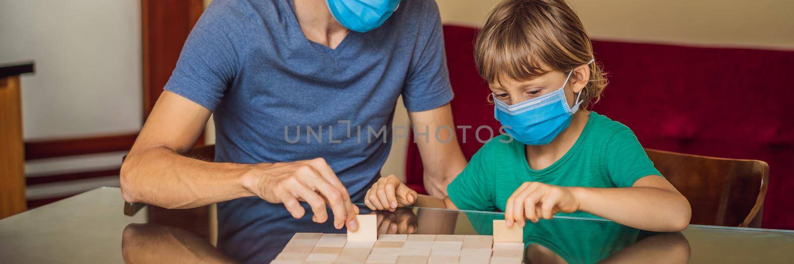 Happy Family Playing Board Game At Home. Stay at home due to quarantine. Coronovirus infection BANNER, LONG FORMAT by galitskaya