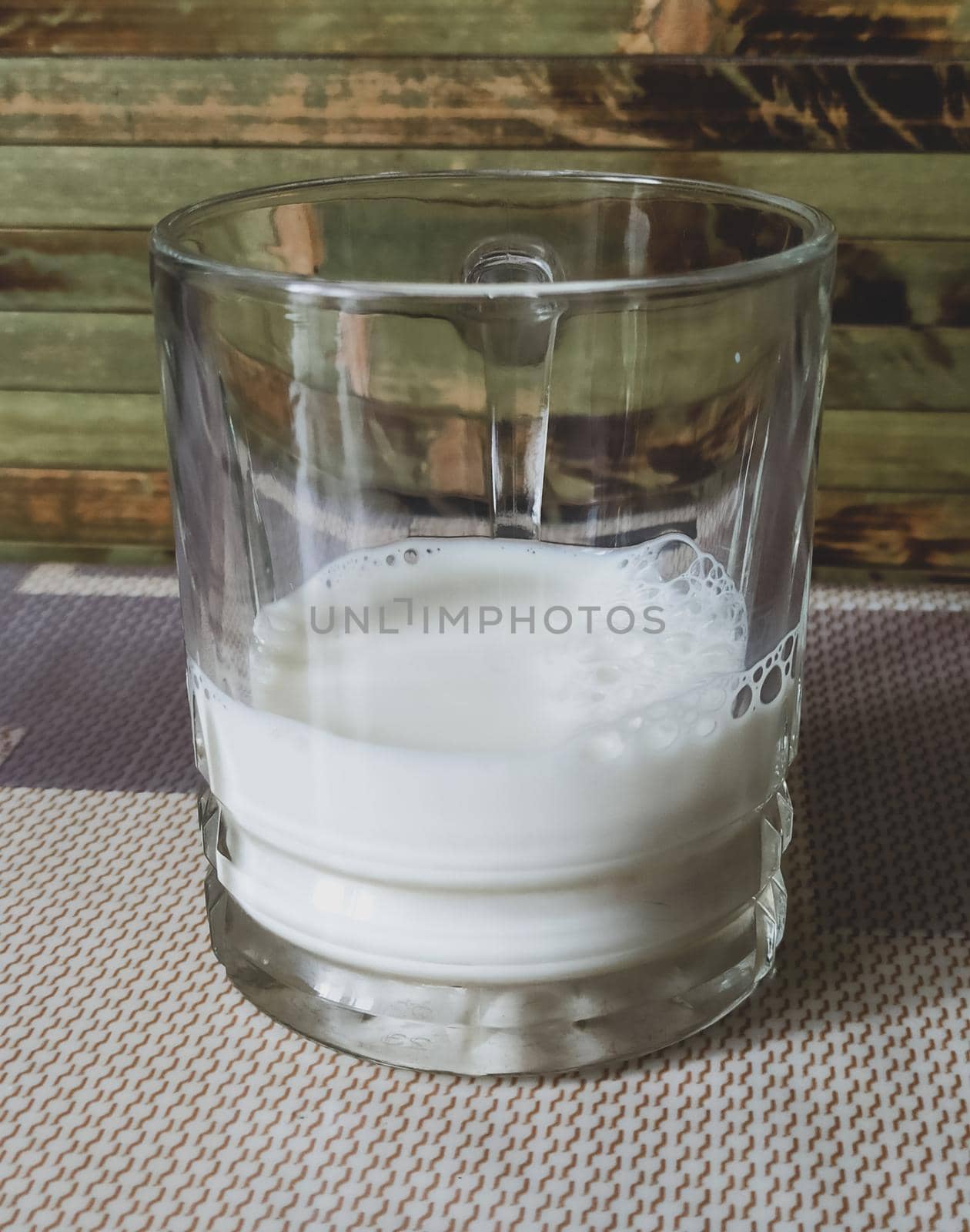 White milk in a transparent glass. Healthy food by biruzza