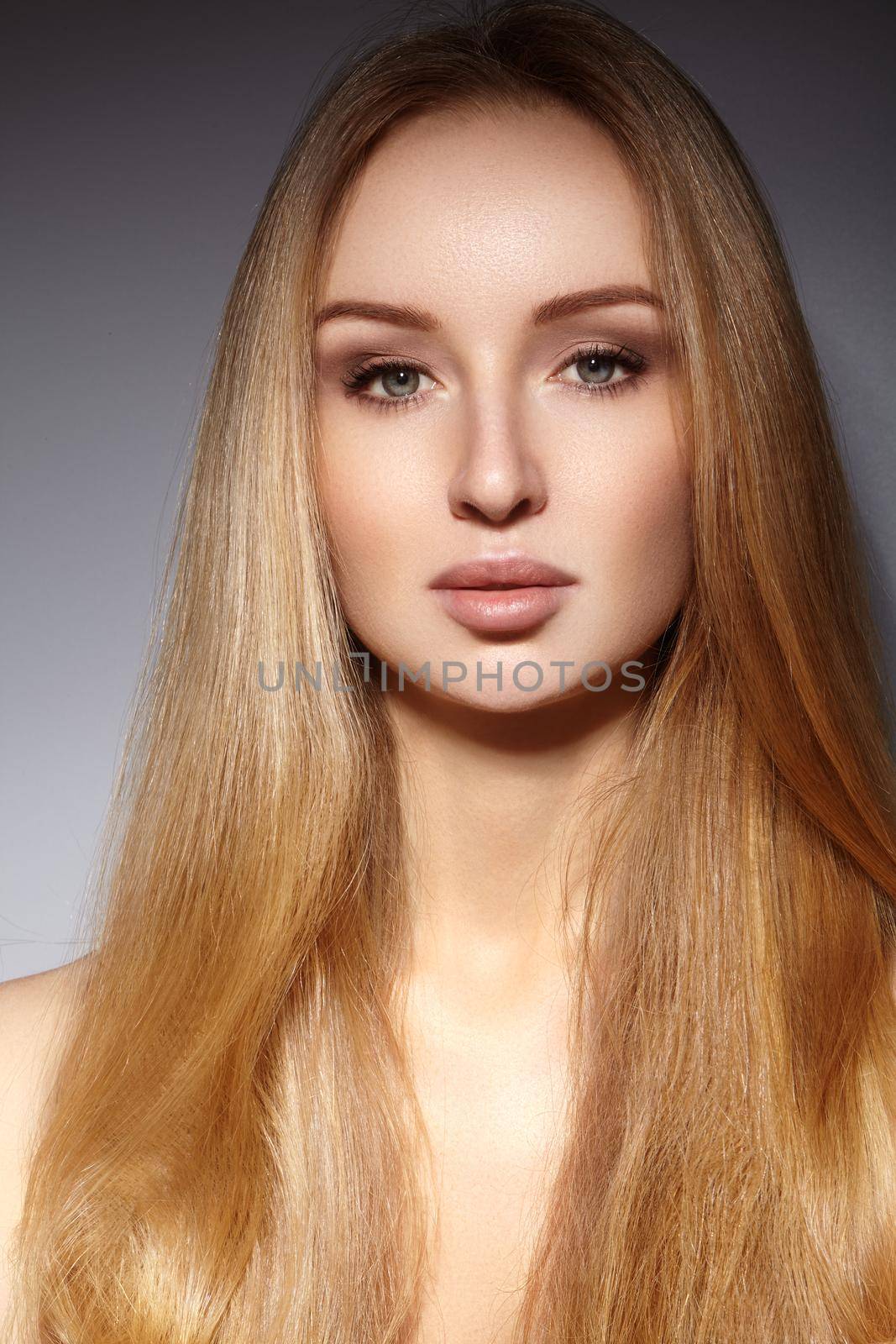 Fashion long hair. Beautiful blond girl. Healthy straight shiny hair style. Beauty woman model. Shine smooth hairstyle