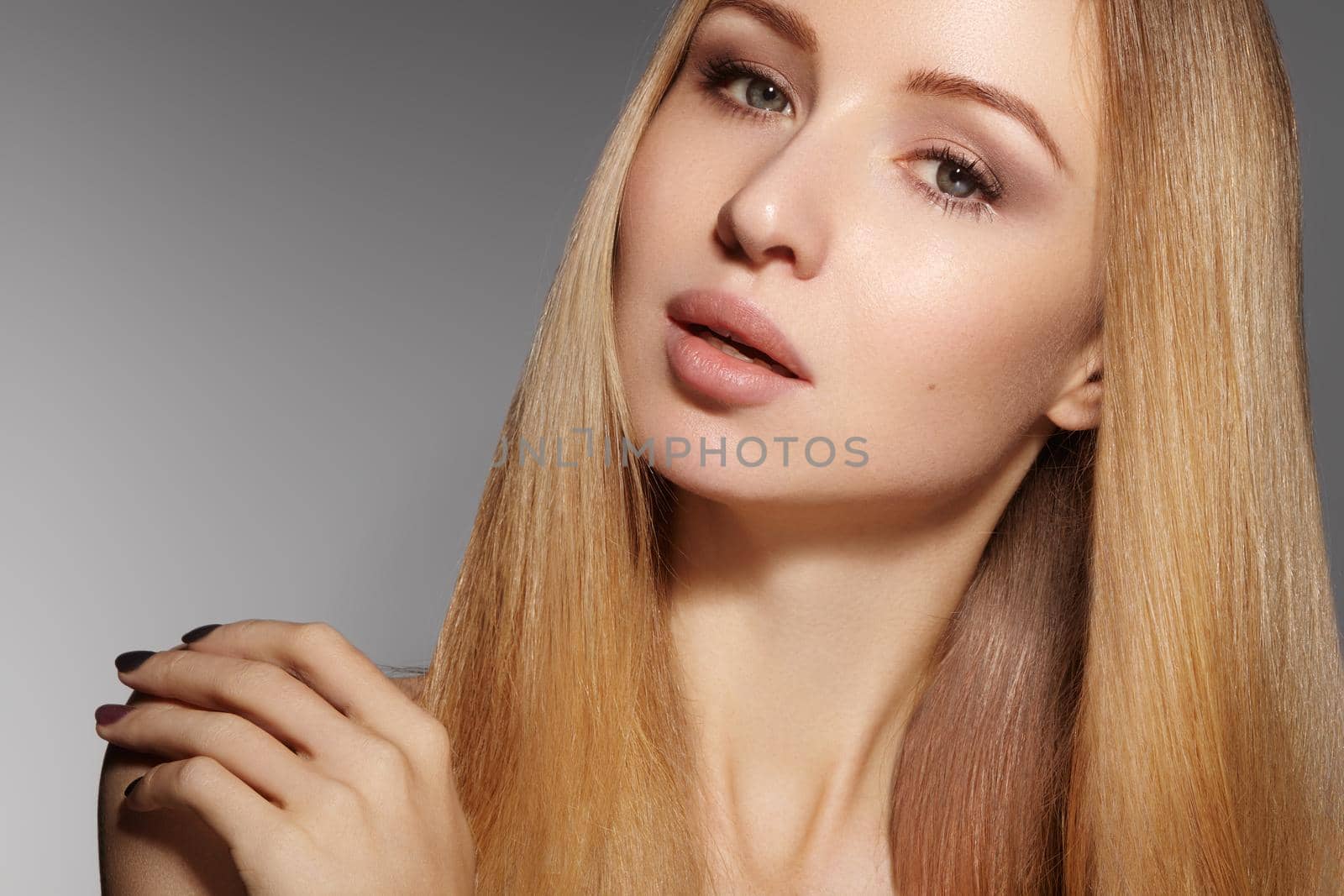 Fashion long hair. Beautiful blond girl. Healthy straight shiny hair style. Beauty woman model. Shine smooth hairstyle